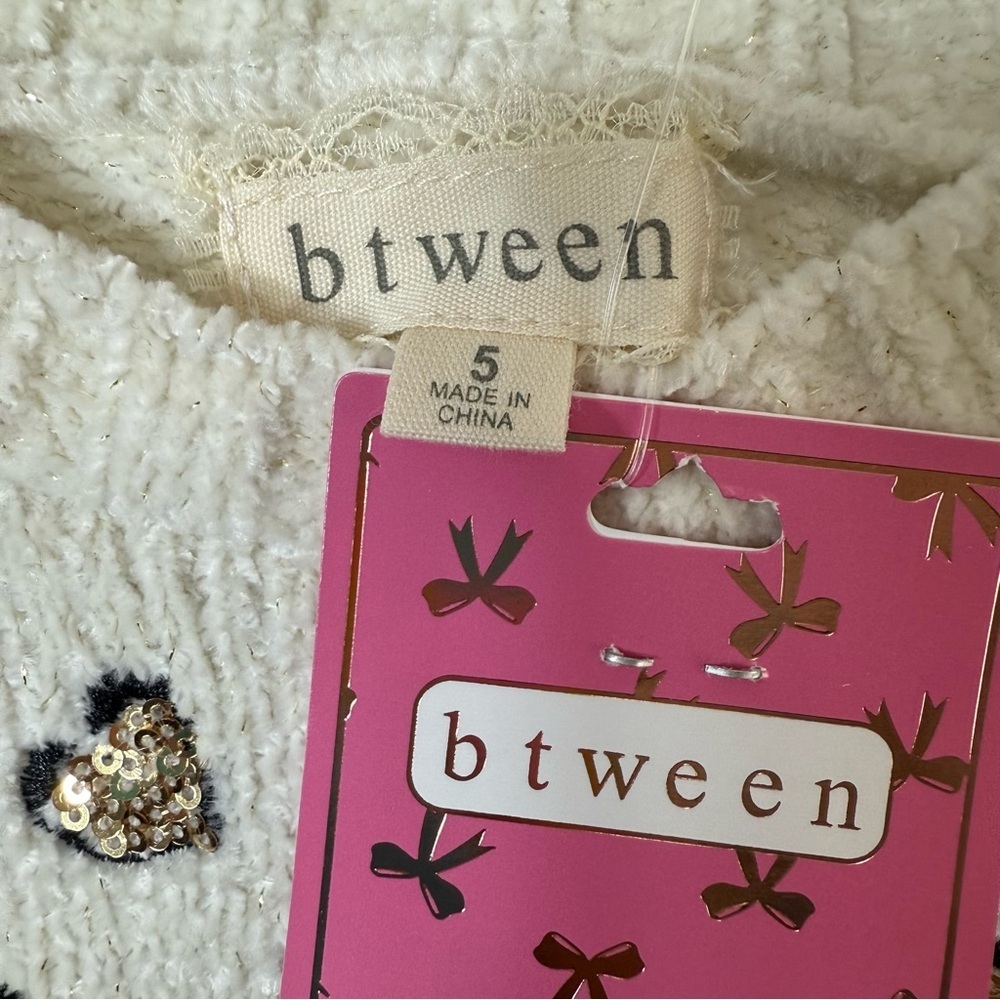 Kids Cream Sweater with Sequin Heart and Black Earmuffs - Picture 4 of 4